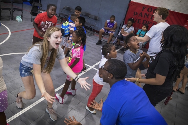 Students at Freedom Schools and volunteers dance