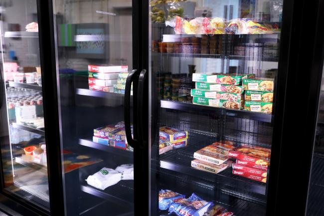 Frozen foods in store-style freezers with glass doors