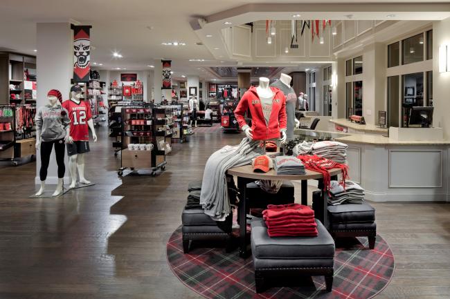 College store interior shows a display of shirts and mannequins wearing Davidson gear