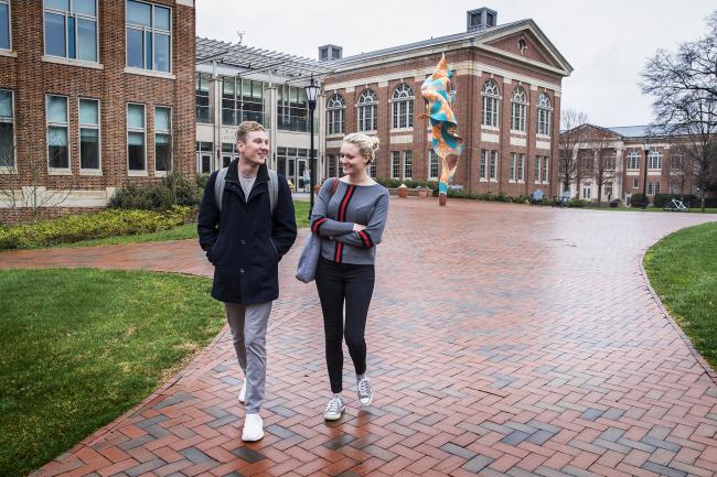 Erica Miller walk on campus with friend