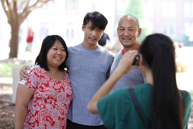 Orientation Farewell Picnic Family w Student Taking Photo