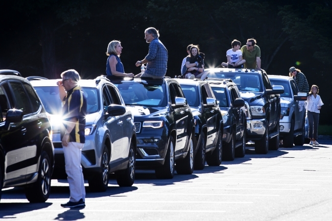 Cars of friends and family lined up 