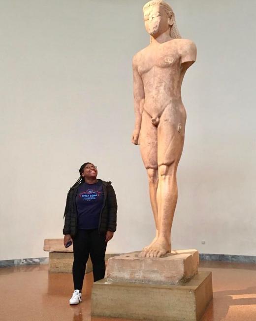 Humester, Jaelyn, next to a kouros depiction for scale