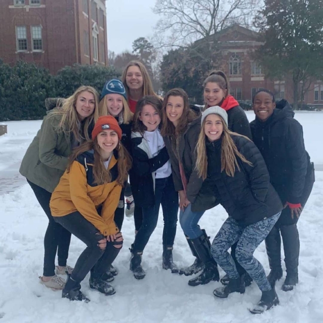 group of friends in the snow
