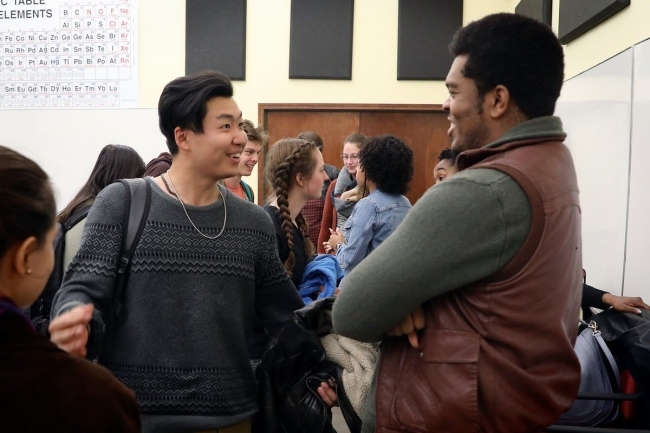 student speaking to cast member of Hamilton