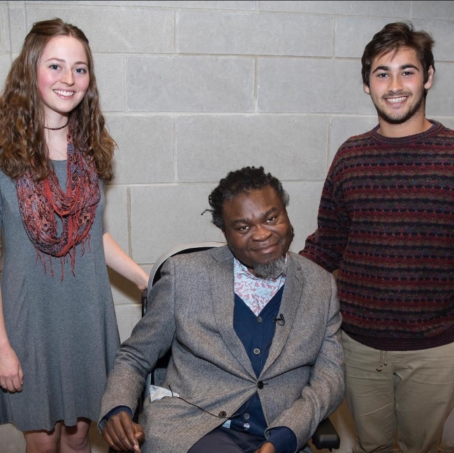 students standing side-by-side with speaker