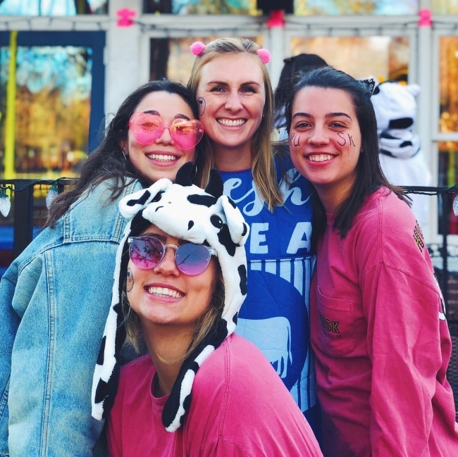 smiling eating house women dressed in their colors