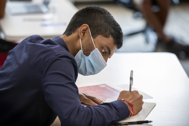 Student Signs Honor Code with Mask On