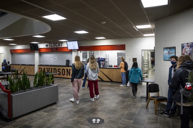 Facade of Wildcat Den with students ordering food