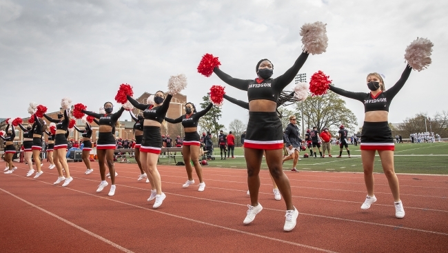 Davidson Cheerleaders Performing at Football Game in Masks