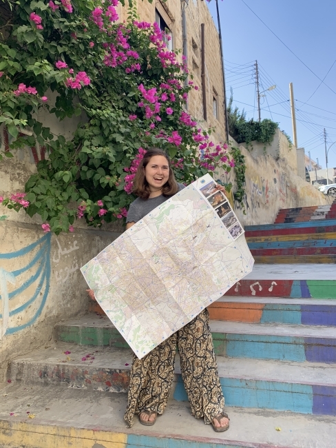 Davidson student with map in Jordan