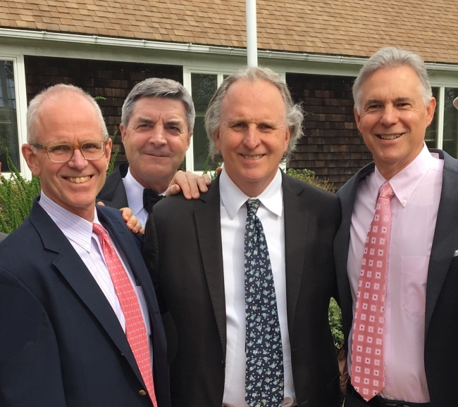 Alums Steve, Roger, Jim and Bruce in suits as a group 