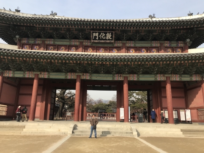 Fall Dean Rusk Grant student in front of building in East Asia 