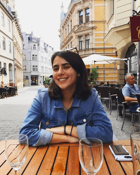 student seated outdoors at restaurant in Germany