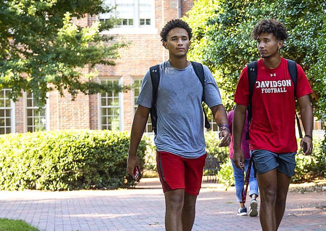 Two Students Walking on Campus