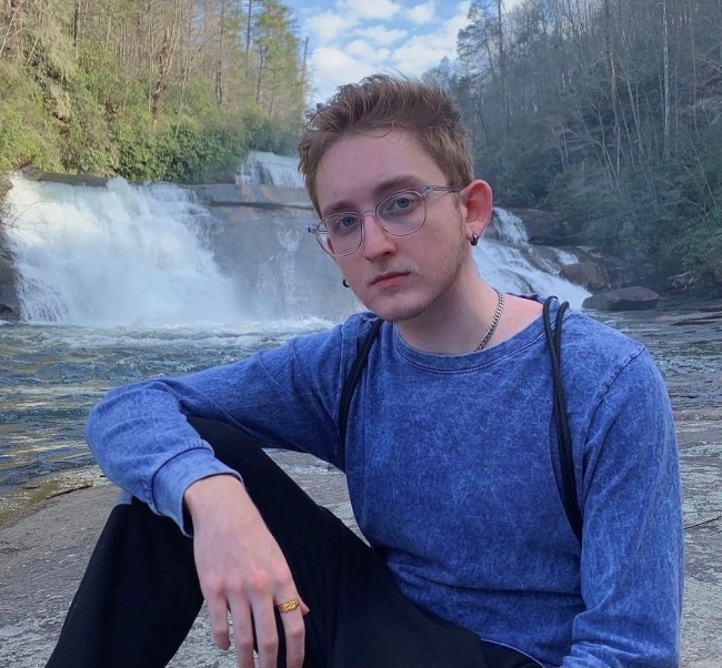 Davidson College music scholarship student Cooper Ray Oljeski '25 headshot by waterfall 