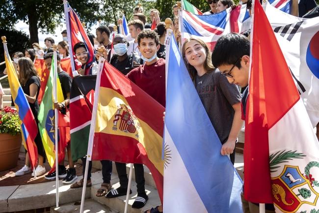 International students holding country flags