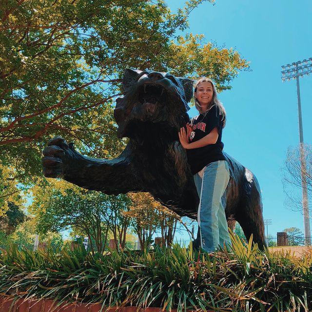 Recently admitted class of 2021 student near wildcat statue