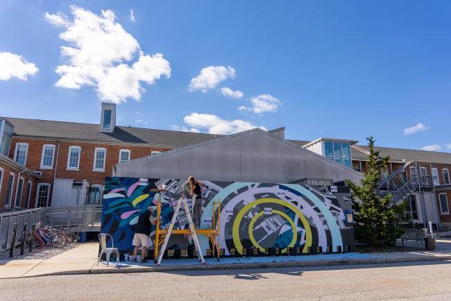 Davidson College Prof. Joelle Dietrick works on "Chasing the Sun" mural project 