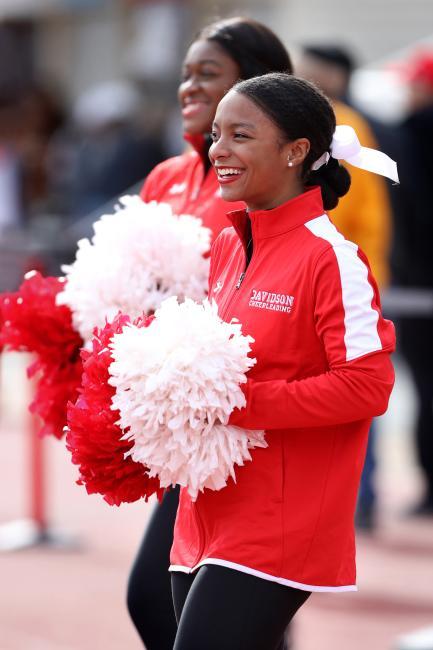 Cheerleader with Pompoms Smiles