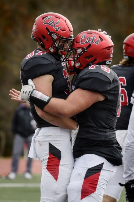 Football Players Hug