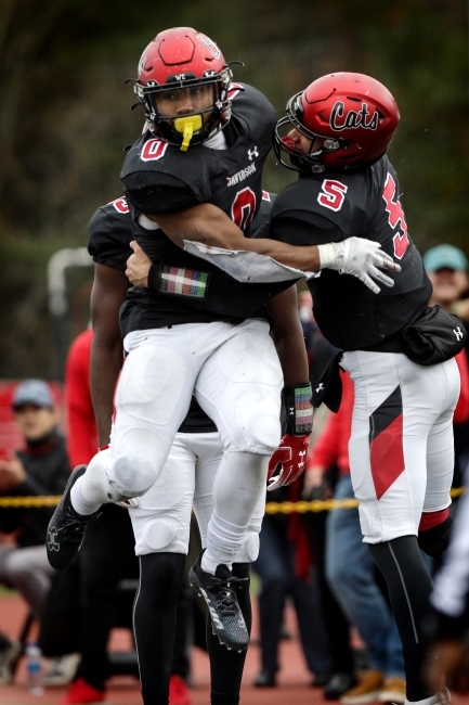 Football Players Jumping