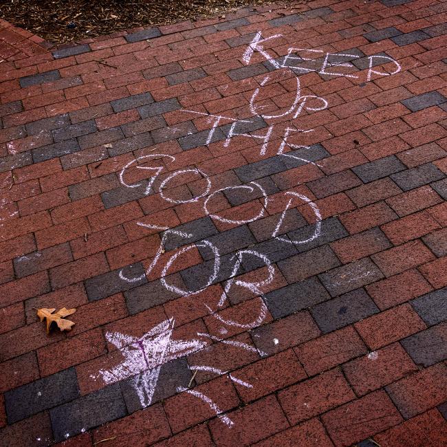 Chalk Drawing on Bricks Saying "Keep Up the Good Job"