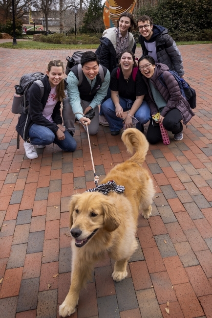 Theo and Students Pose For a Photo