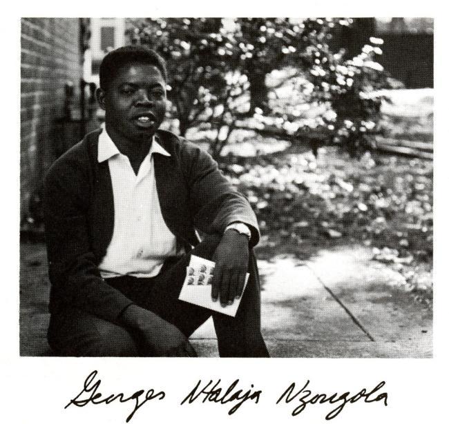 Georges Nzongola-Ntalaja '67 as a young adult boy sitting outside with his hand-printed signature below the photo