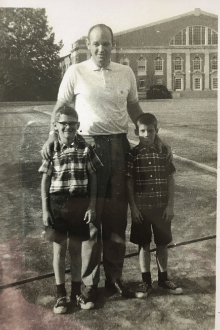 Coach Lefty Driesell with kids Bertis and Bill downs on Davidson football field