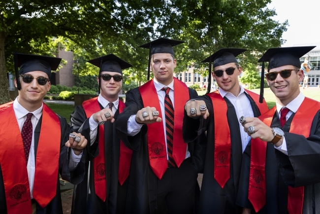 Group of students showing their rings at Class of 2022 Commencement