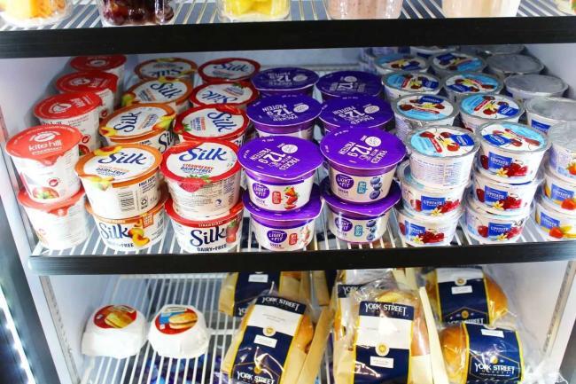 yogurts on shelf in fridge