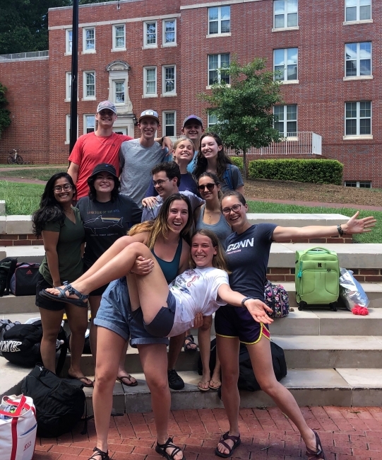 A group of students smiling together during first year orientation