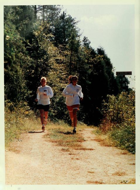 Page from Quips & Cranks 1993 where students are running together on trail
