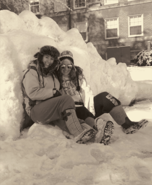 Students in snow pile on campus
