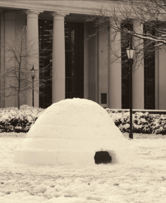 Snow igloo on campus in front of library