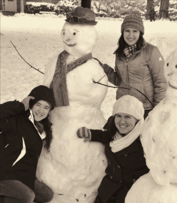 Students with snowman on campus