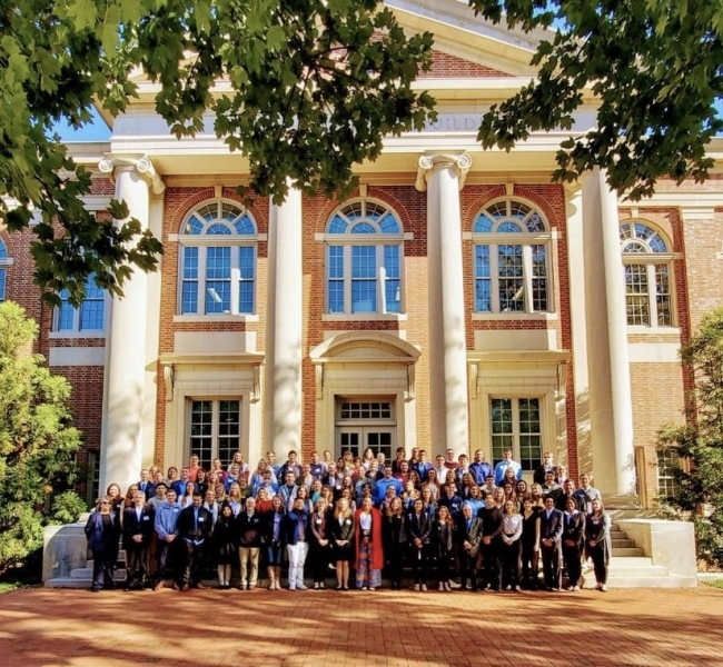 group of people in front of academic building