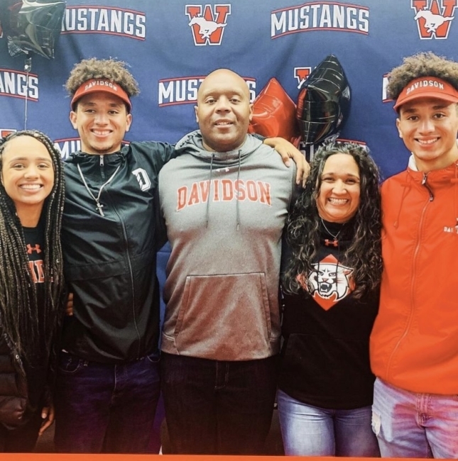 Admitted Students on football team with family