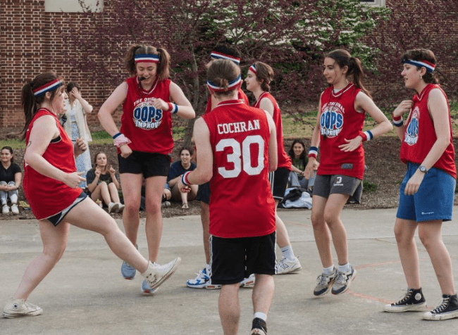 students in basketball jerseys dancing