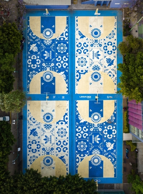 Four basketball courts seen from the air