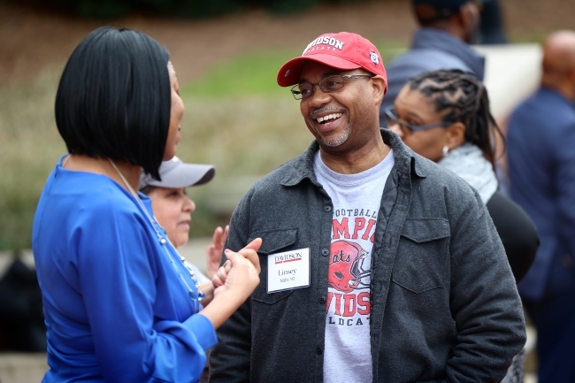 Man and woman speaking and smiling at BSC celebration