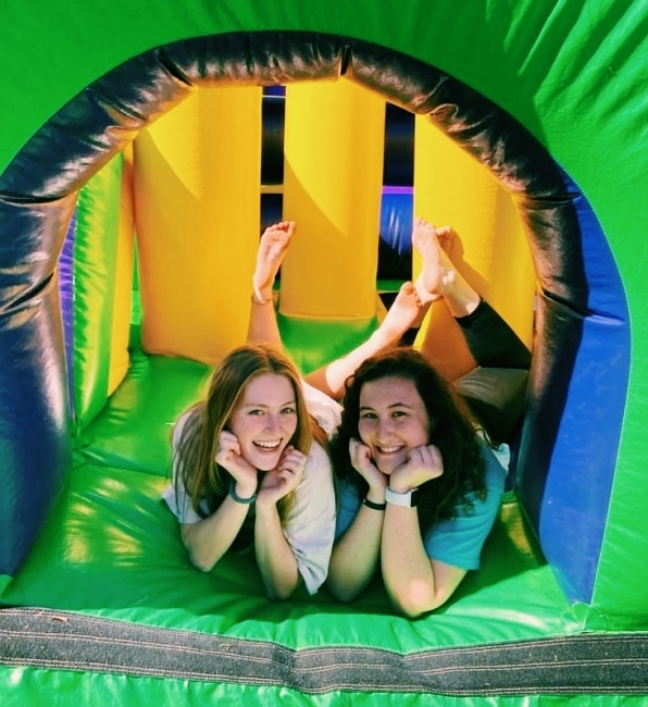 PCC org women in bouncy house