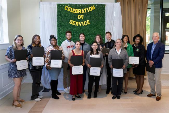 Group of students at Celebration of Service holding awards
