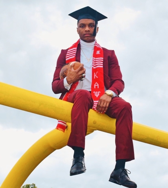 NPHC Fraternity Man with football