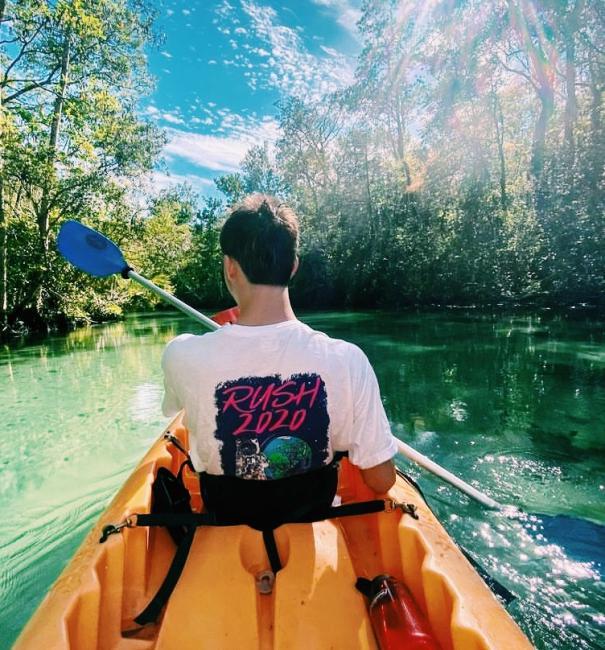 man kayaking with tshirt that reads "rush 2020"
