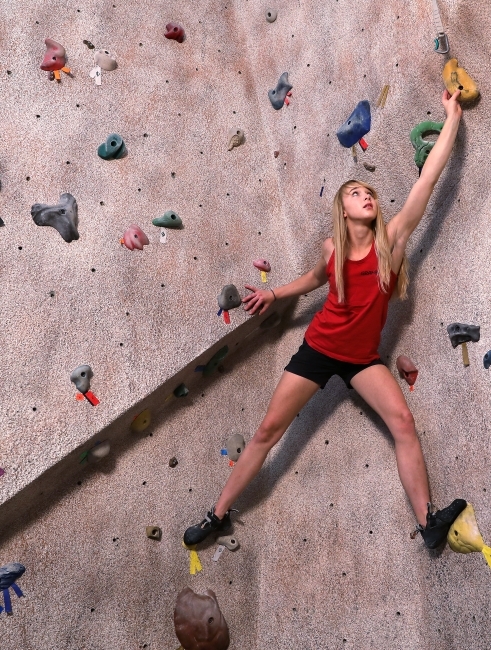 Climber Bimini Horstmann on DO Bouldering Wall