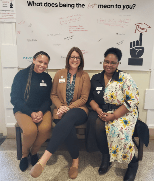 Three women sitting together and smiling