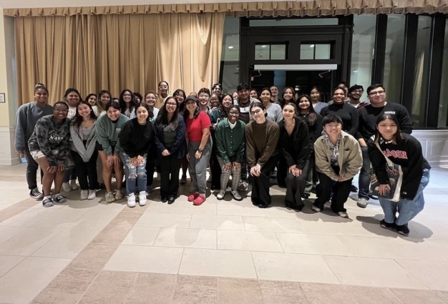 Group of students smiling and standing together