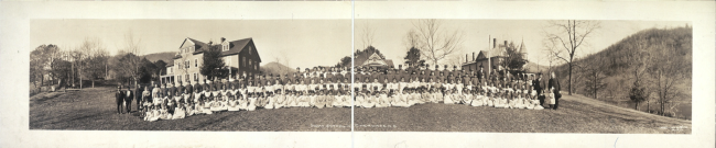 Children in front of an Indian School in Cherokee, North Carolina. Copyright claimed by Herbert W. Pelton c1909. From the Library of Congress panoramic photographs collection.